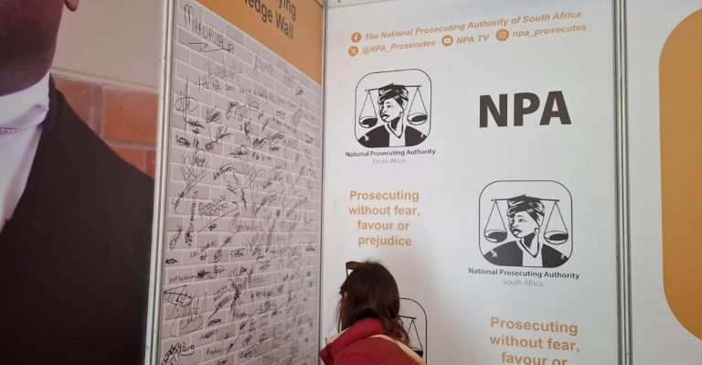 Fake ABSA fraud official steals R21.55 million from Mpumalanga company Asset Forfeiture Unit officials and legal documents representing the High Court's recovery of R21.55 million stolen in a sophisticated online banking fraud.