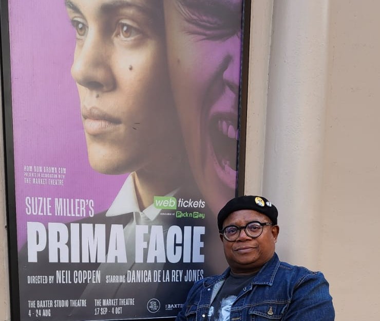 Sandile Memela standing outside the Market Theatre in Johannesburg, where Prima Facie is being performed.