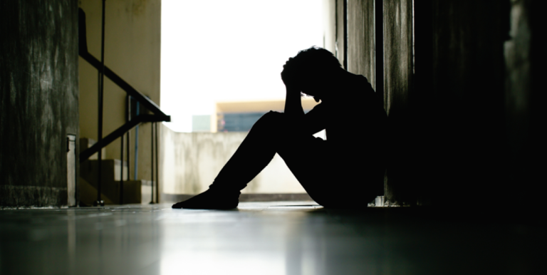 Don’t call me resilient: Why unemployed youth need support, not praise for coping Young person affected by mental health challenges, illustrating the emotional toll of unemployment and the need for supportive communities and accessible opportunities.