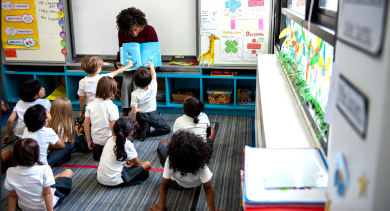 World Teachers’ Day: South Africa cannot afford to leave qualified teachers outside the classroom South African teacher standing in a classroom with learners during a lesson.